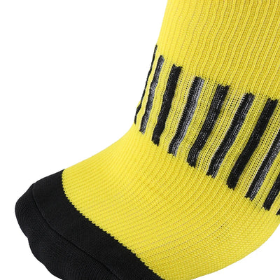 Close-up of yellow compression socks featuring geometric black stripes, ideal for sports and diabetic support.