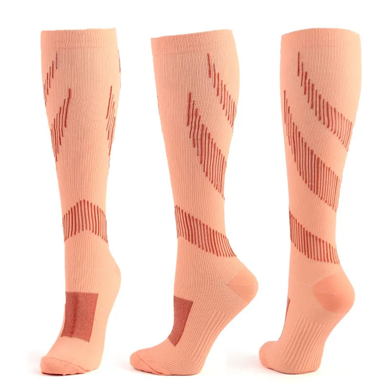 Compression socks in peach color with geometric patterns, designed for varicose veins, sports, and diabetic support.