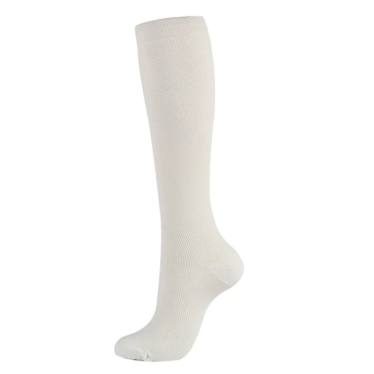 White compression socks for men and women, designed for varicose veins and comfort during sports and everyday use.