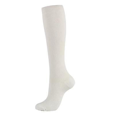 White compression socks for men and women, designed for varicose veins and comfort during sports and everyday use.