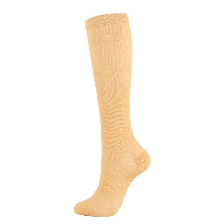 Beige compression socks ideal for varicose veins, suitable for men and women, versatile for sports and daily use.