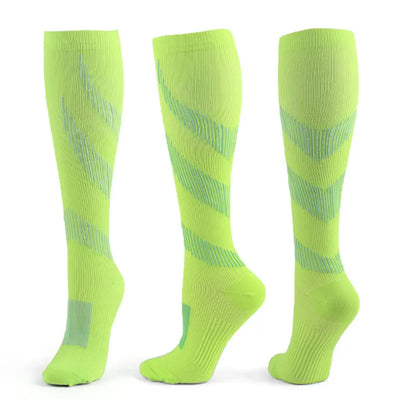 Light green compression socks designed for varicose veins relief, suitable for men and women, ideal for sports and daily wear.
