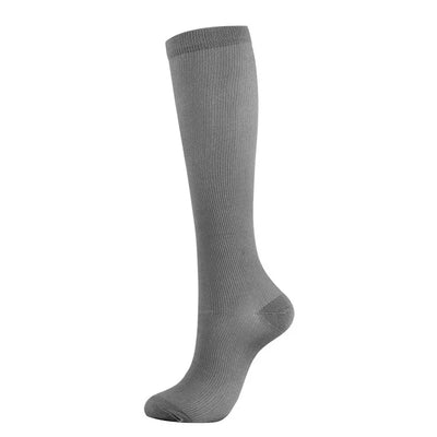Gray compression sock for men and women, ideal for varicose veins and diabetic support during sports and hiking.