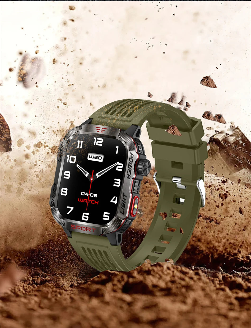 Military GPS smartwatch in rugged design, featuring a green strap and sporty style against a muddy background.