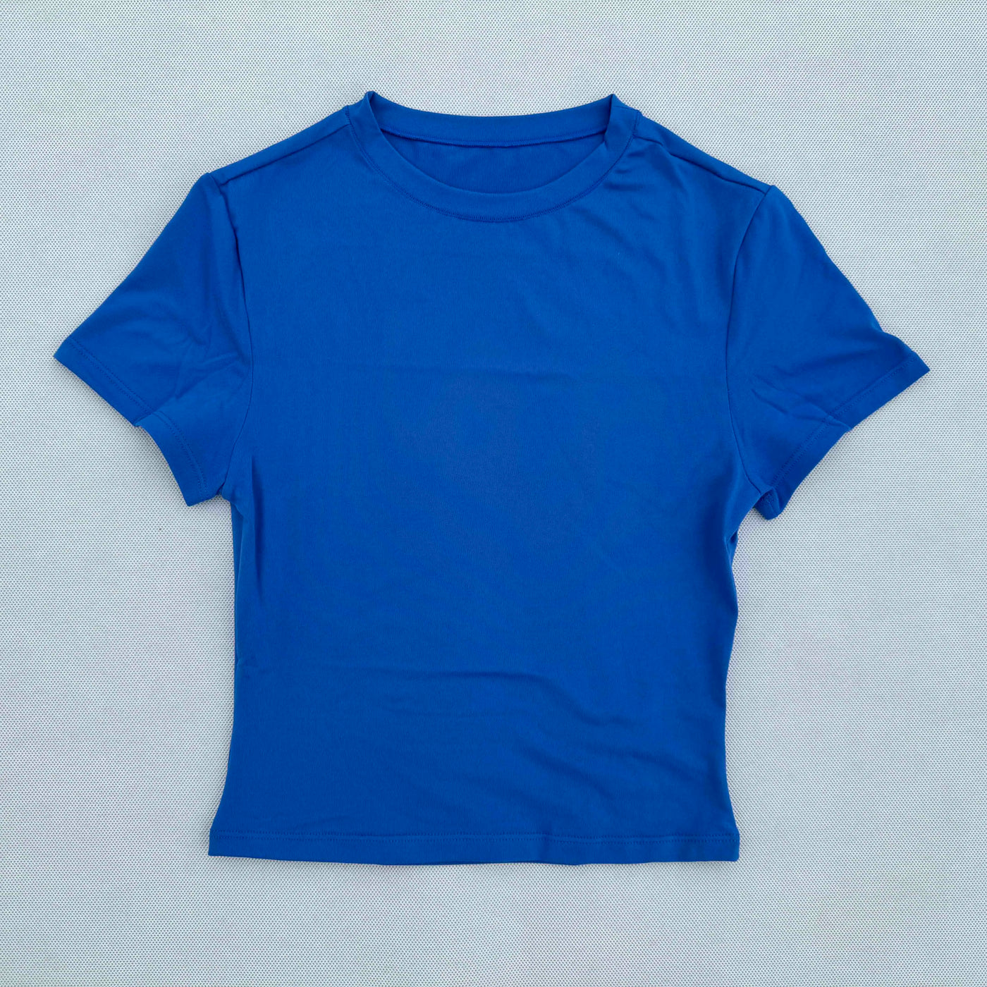Blue women's short sleeved sports t-shirt, quick drying and breathable fabric, perfect for yoga and fitness.