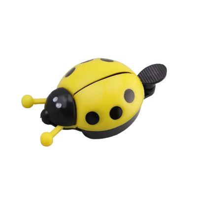 Cartoon ladybug bike bell in yellow and black, mini bicycle horn for kids and girls, made from plastic and aluminum.