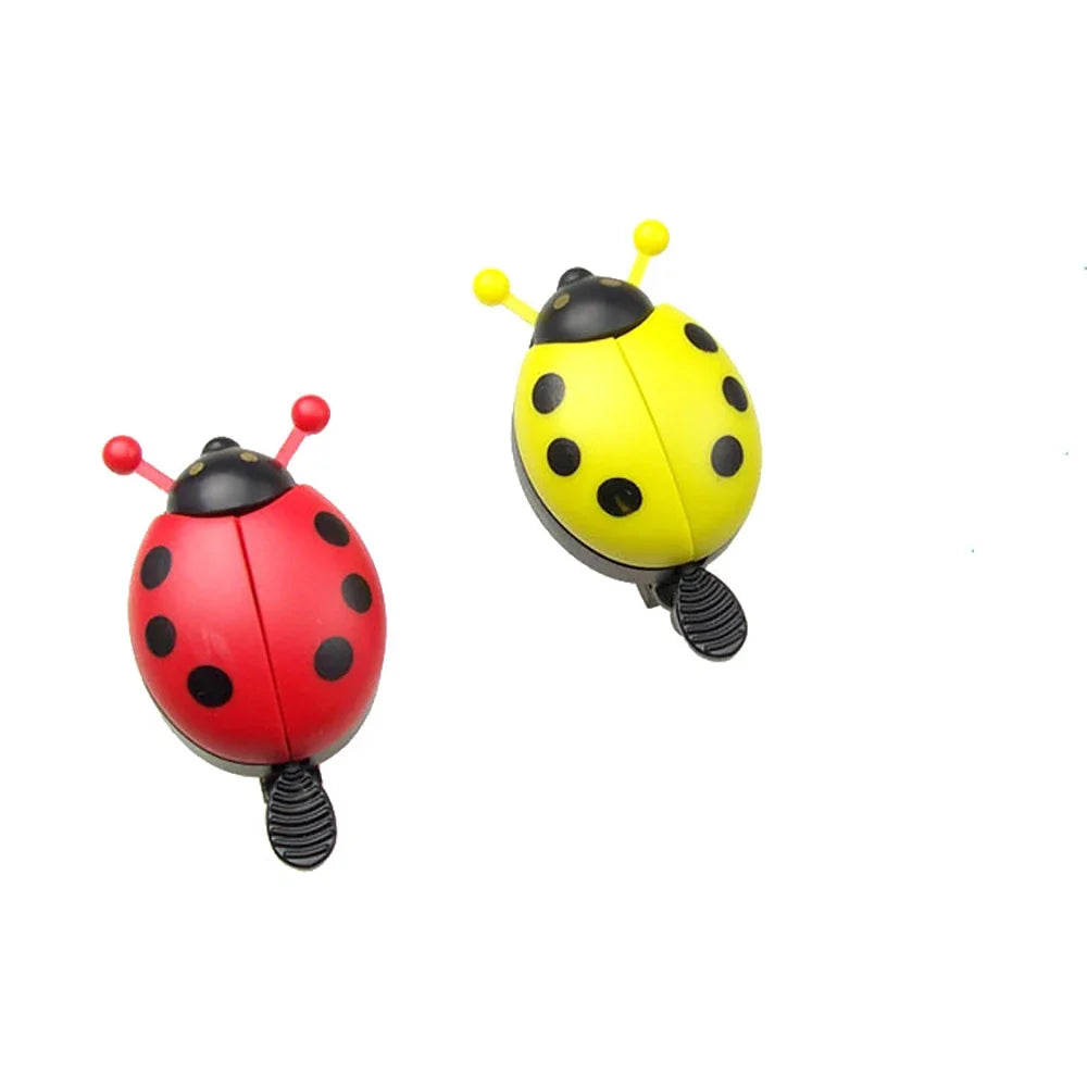 Cartoon ladybug bike bells in red and yellow, cute mini bicycle horns for kids and girls.