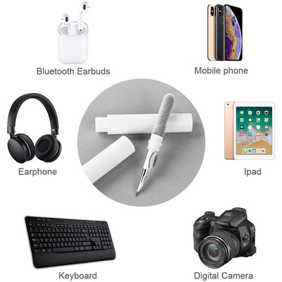 Bluetooth earphone cleaning kit pen brush tool surrounded by earbuds, mobile phone, iPad, keyboard, and digital camera.