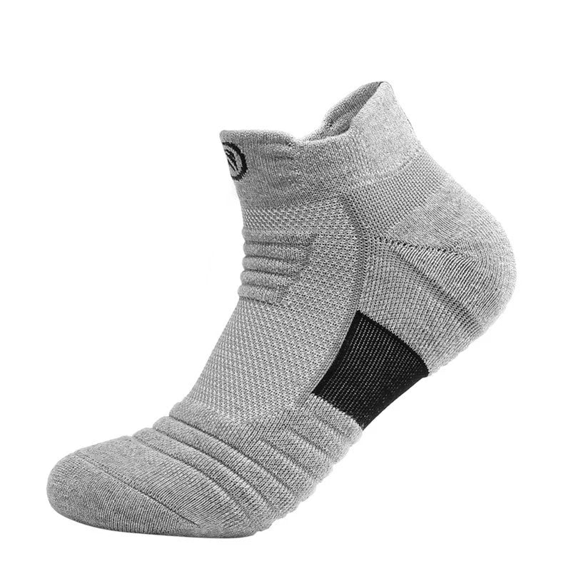 Elastic compression sports sock in grey, designed for breathability and comfort during basketball and athletic activities.