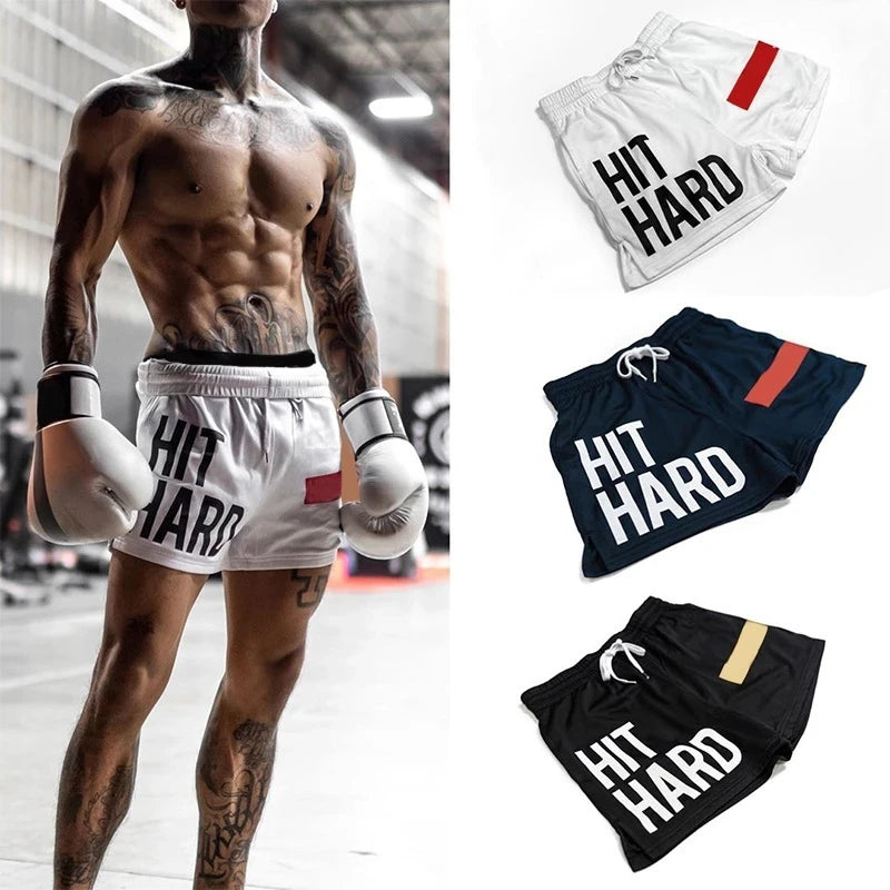 Men's fitness shorts with 'HIT HARD' text, available in white, navy, and black colors, designed for workouts and boxing.