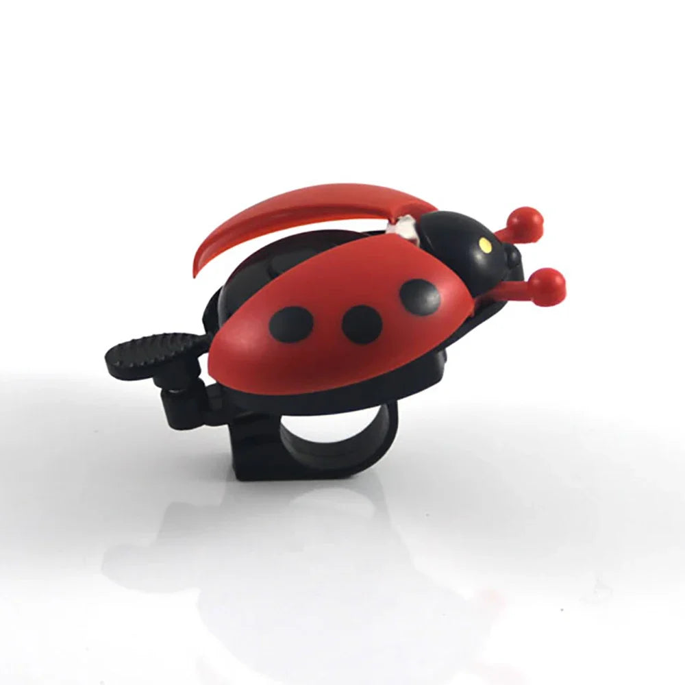 Cartoon ladybug bike bell - cute mini bicycle horn for kids, red and black design with antennae and spots.