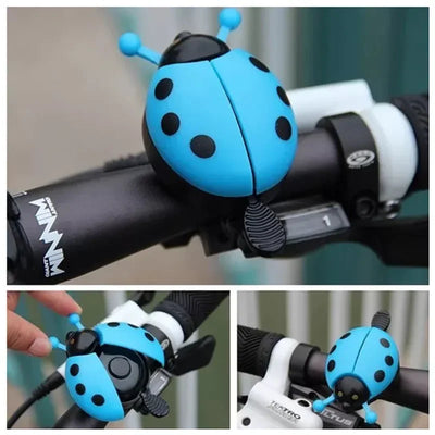 Blue cartoon ladybug bike bell mounted on a bicycle handlebar, perfect for kids and girls.