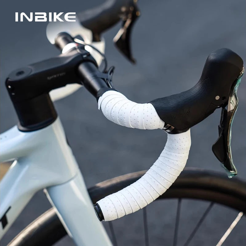 INBIKE soft grip handlebar tape in white on a bicycle, providing non-slip and lightweight performance for cyclists.