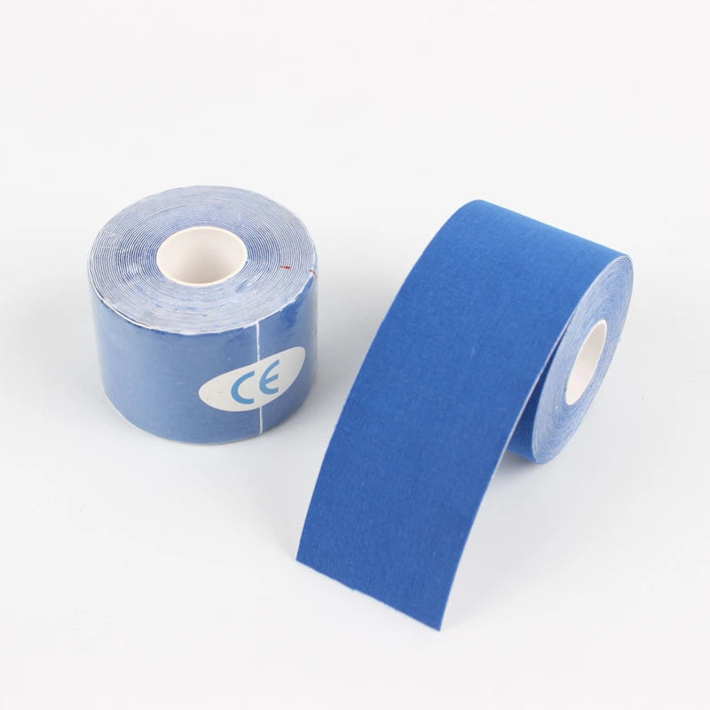 Roll of blue kinesiology tape for muscle support and knee pain relief during athletic recovery.