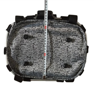 Inside view of a foldable bike front basket pet carrier with measuring tape, featuring a patterned fabric.