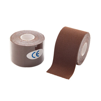 Roll of brown kinesio tape for muscle support and knee pain relief in athletic recovery.