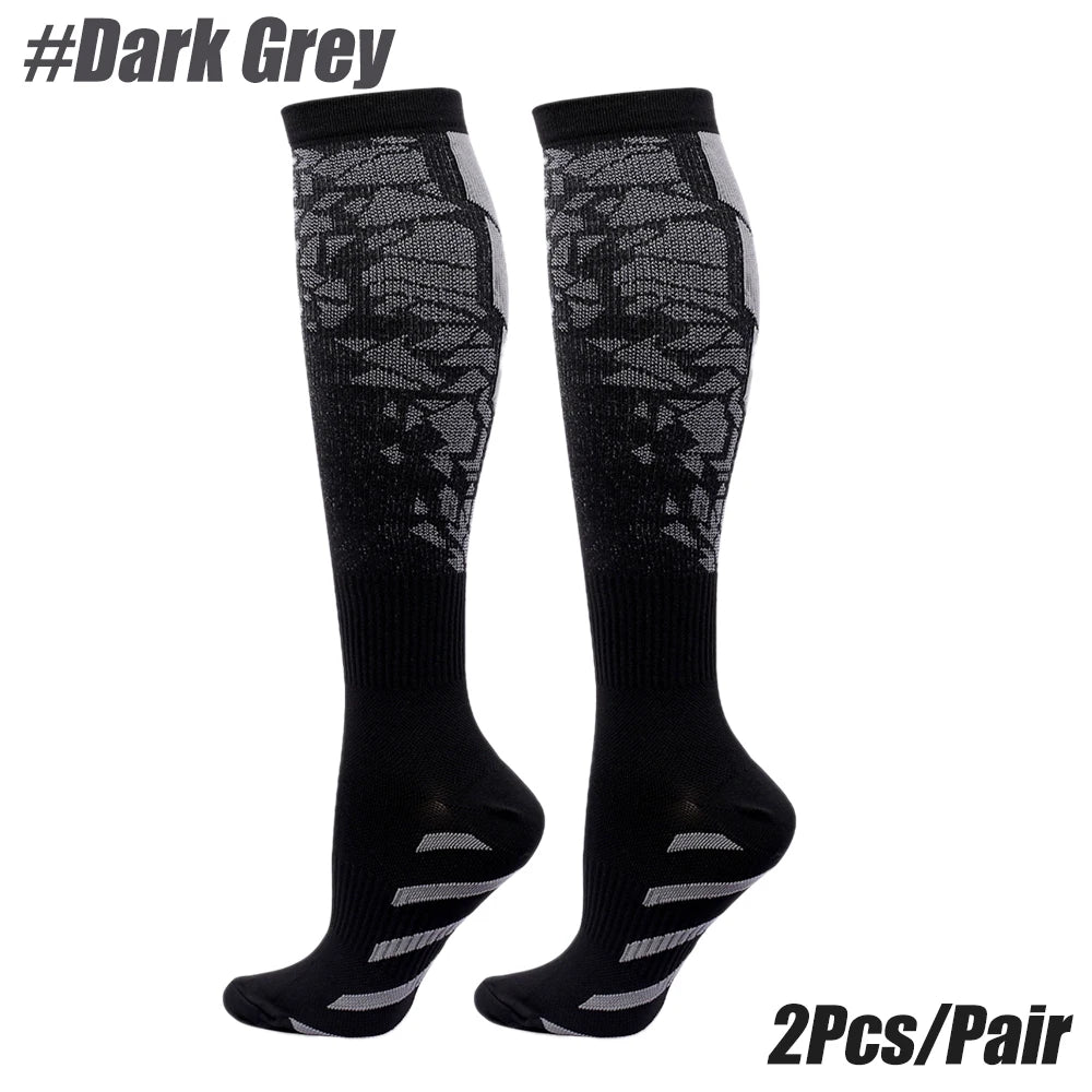 Dark grey compression socks for men and women, ideal for calf support and running, sold in pairs.