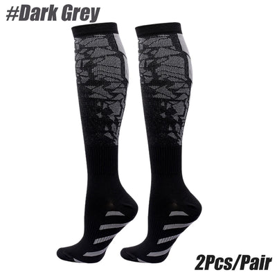 Dark grey compression socks for men and women, ideal for calf support and running, sold in pairs.