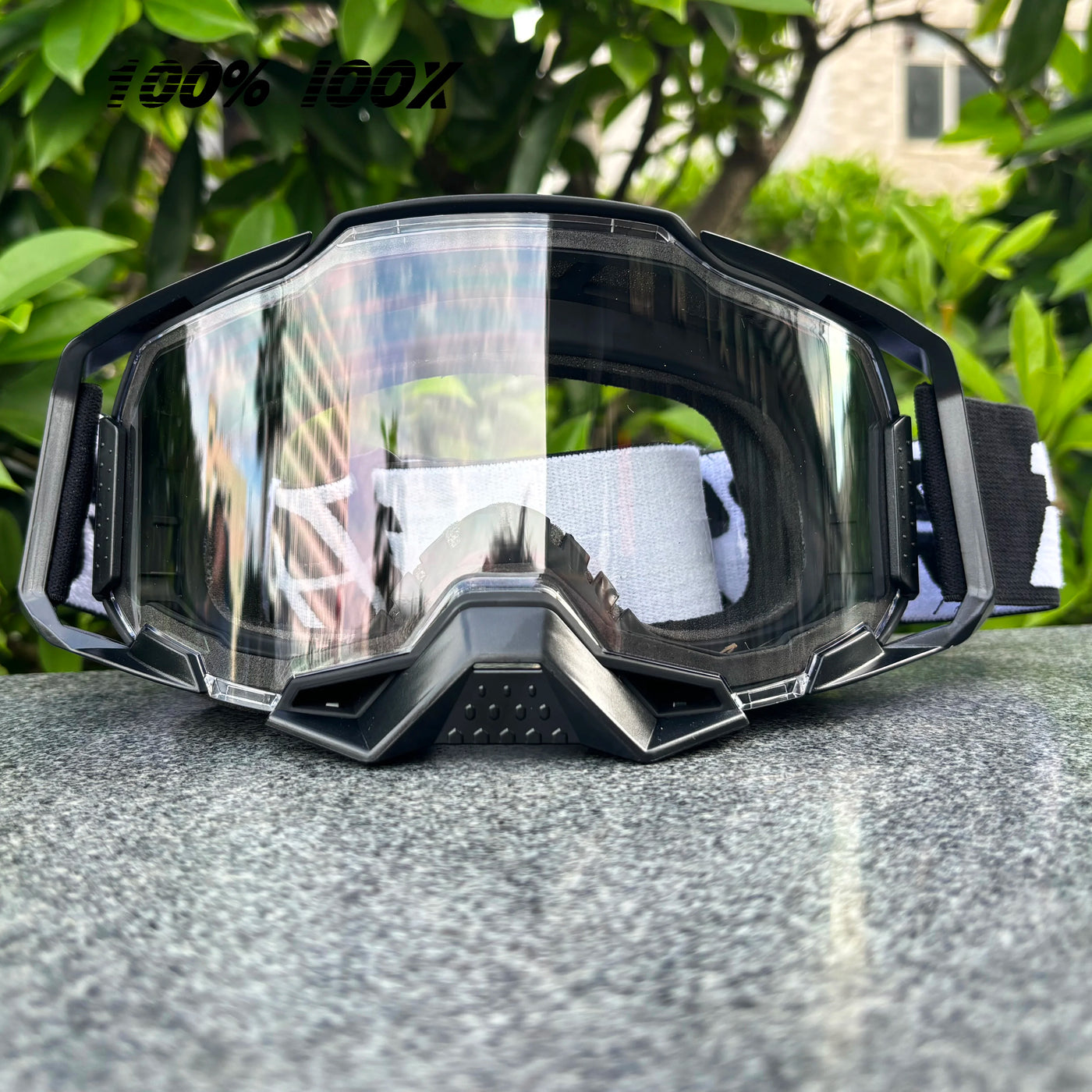 100% IOOX Motorcycle goggles with clear lens for off-road MTB dirt bike racing, designed for unisex wear and maximum protection.