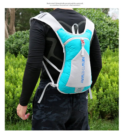 Ultralight waterproof hydration backpack in blue and gray, designed for outdoor running and cycling, worn by a person.