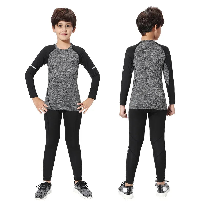 Kids winter thermal sports set, compression tights and top in gray and black for running, suitable for boys and unisex.