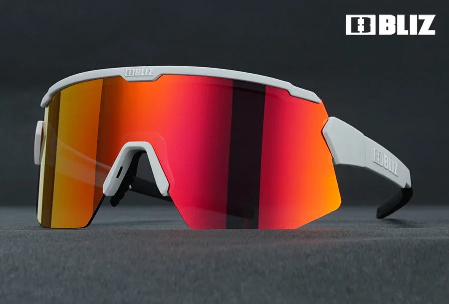 BLIZ Breeze Polarized Cycling Glasses with UV protection, featuring a stylish white frame and vibrant colored lenses.