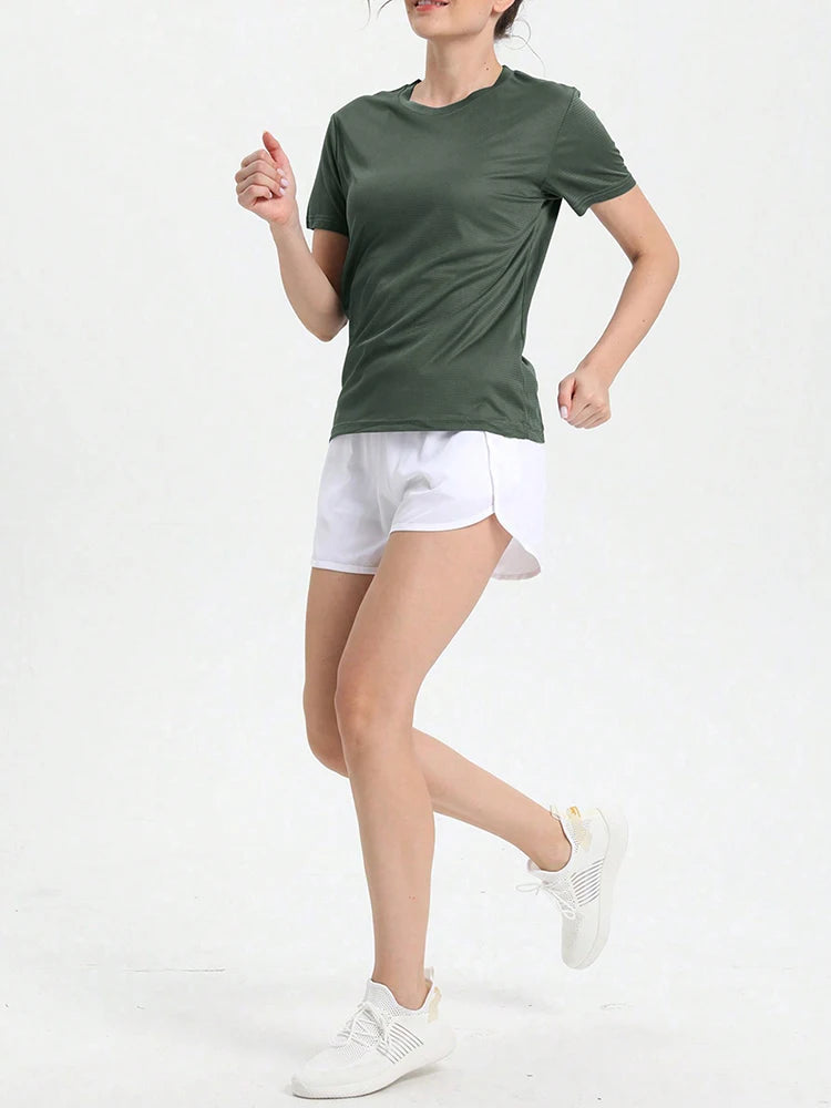Woman wearing a women's solid color ultralight quick dry sport t-shirt, perfect for running and gym activities.