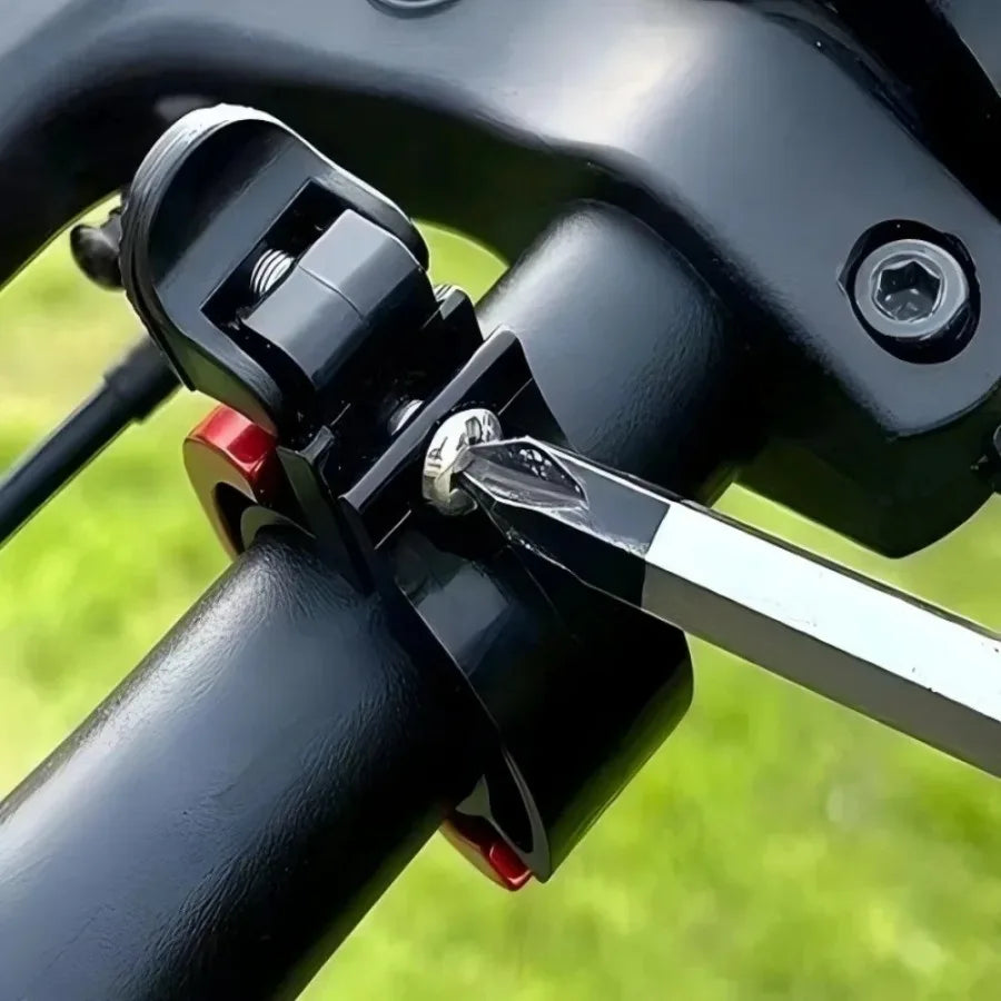 Close-up of a bike handlebar bell being installed using a tool for enhanced cycling safety.