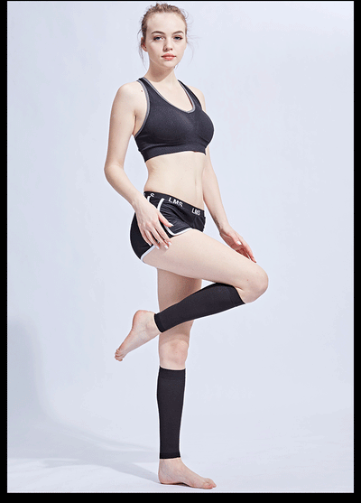 Model demonstrating footless compression calf socks in black, ideal for varicose veins and edema.