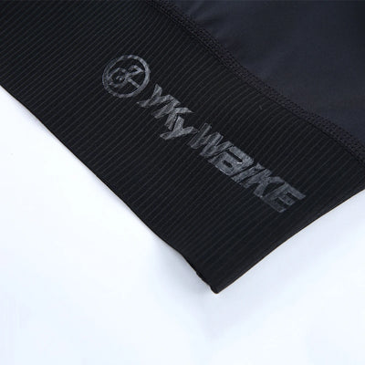 Close-up view of YKYWBIKE cycling bib shorts waistband showcasing logo and material texture.