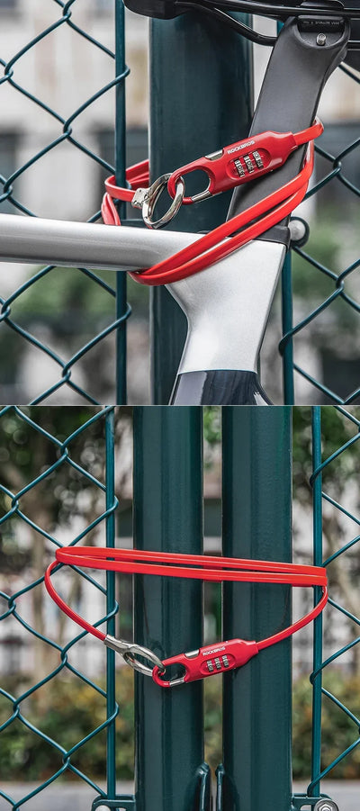 ROCKBROS high-security bike lock anti-theft chain securing a bicycle to a fence with a combination lock