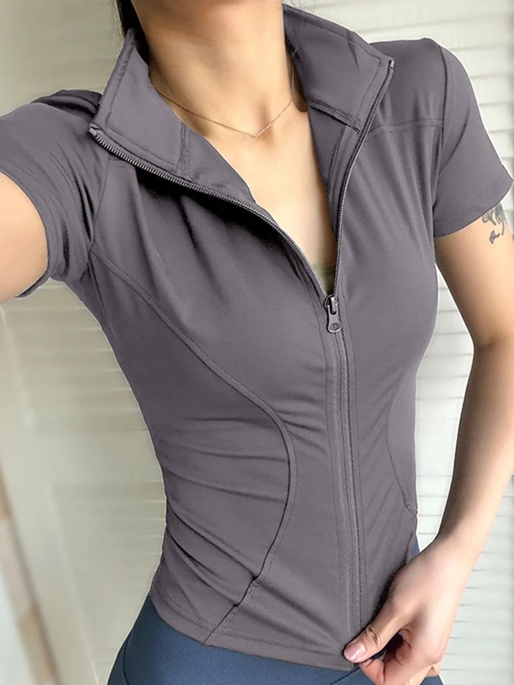 Women’s slimming yoga top in gray, featuring a zip closure, stand collar, and short sleeves, ideal for spring and summer workouts.