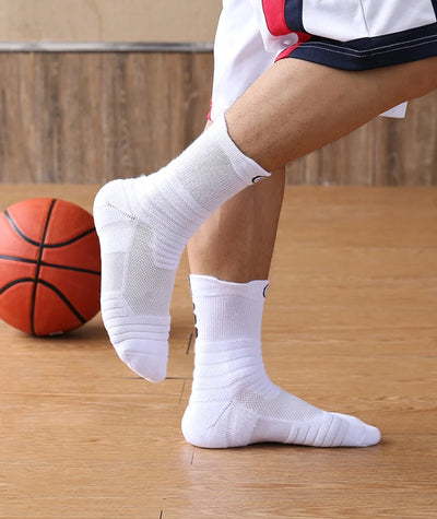 Men's elastic compression sports socks worn during basketball, featuring breathable material and a towel tube design.
