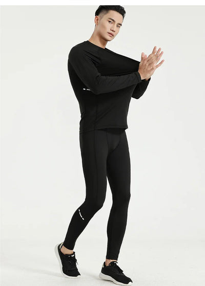 Men's black compression sportswear set featuring a long sleeve top and leggings, ideal for gym training and workouts.