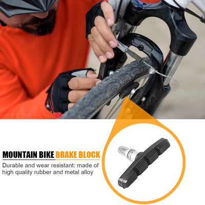 Mountain bike brake block made of durable rubber and metal alloy for reliable braking performance.