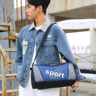 Man carrying a blue sport gym bag, wearing a denim jacket, perfect for fitness and travel.