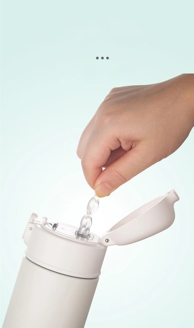 Hand opening GIANXI stainless steel insulated water bottle for easy access to beverages.