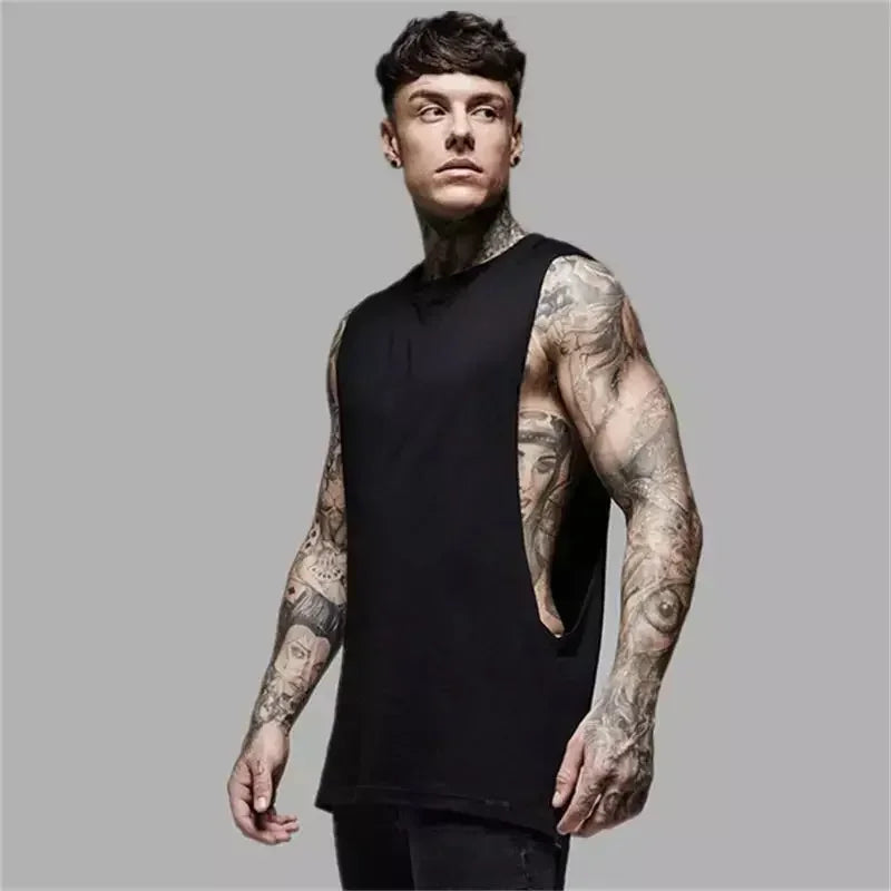 Solid black sleeveless men's fitness shirt, showcasing tattoos, ideal for gym bodybuilding, made from cotton.