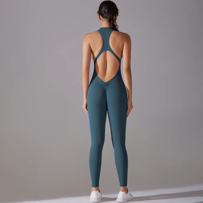 Back view of a women’s body suit in teal color, designed for yoga and fitness, showcasing tummy control and butt lifting features.