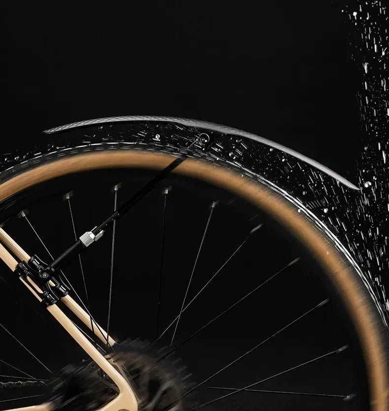 Bicycle mudguard fender in action on a road bike, showcasing its soft PP plastic design and flexibility.