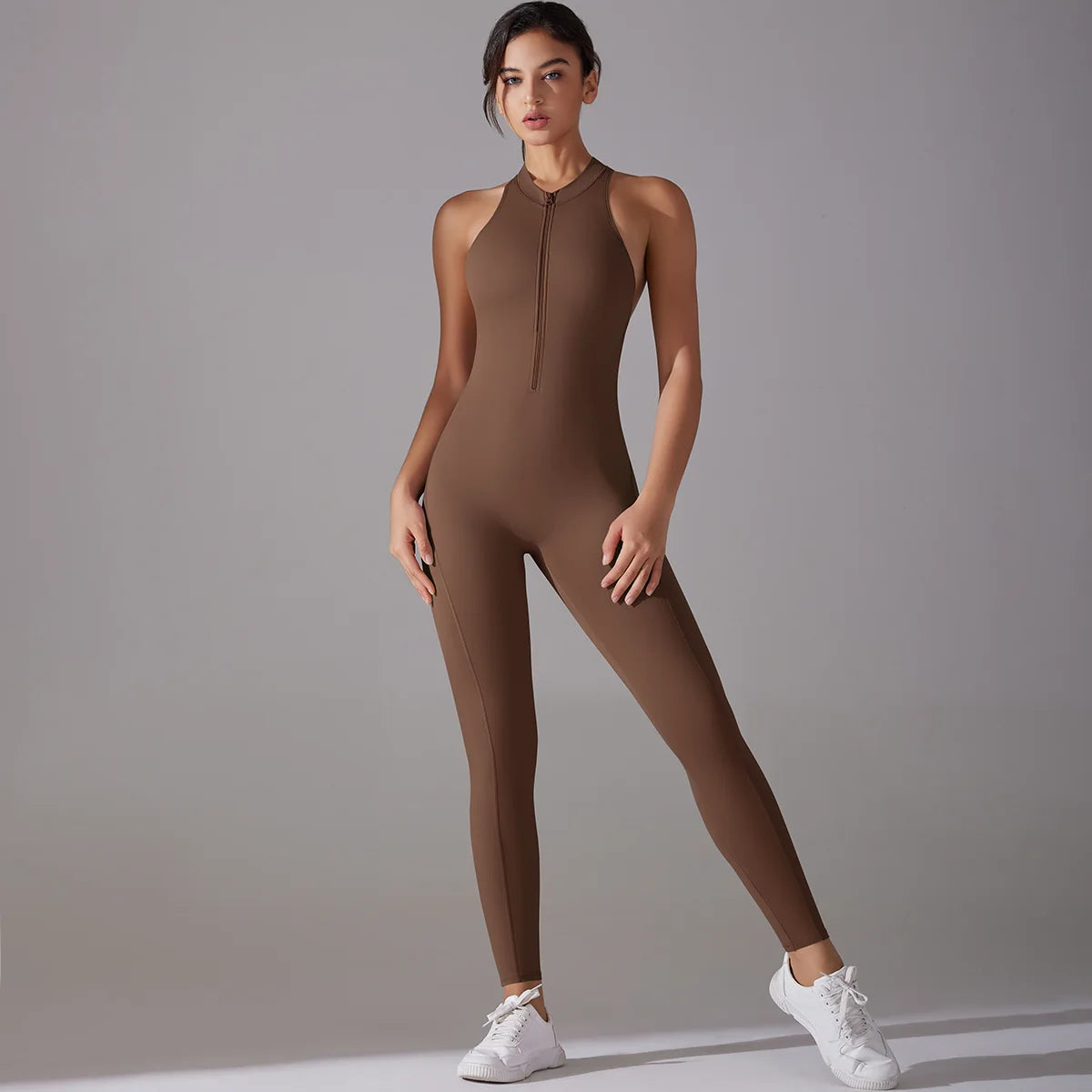 Women in a brown bodysuit showcasing tummy control and butt lifting features for gym workouts and yoga.