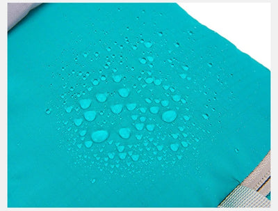 Close-up of ultralight waterproof hydration backpack showing water droplets on the fabric.