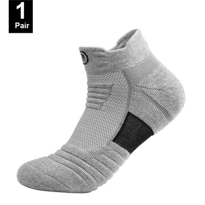 Elastic compression sports socks in gray, designed for breathability and comfort during basketball and other activities.