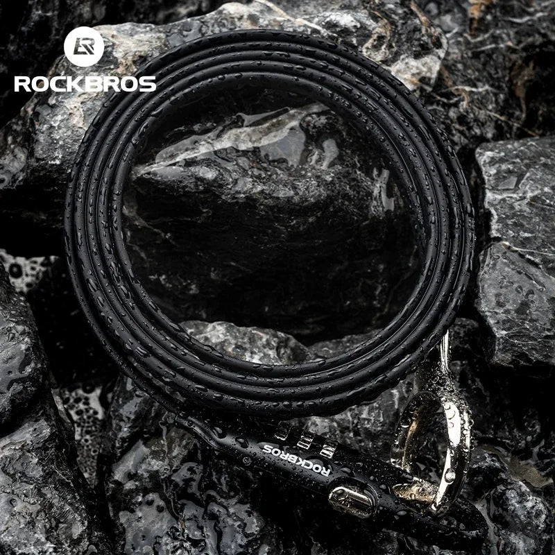 ROCKBROS high-security bike lock chain resting on wet rocks, designed for bicycles and e-bikes, made of durable steel.