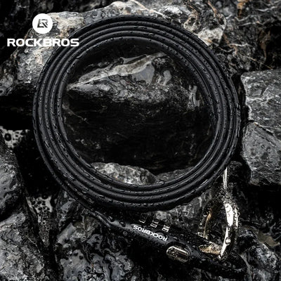 ROCKBROS high-security bike lock chain resting on wet rocks, designed for bicycles and e-bikes, made of durable steel.
