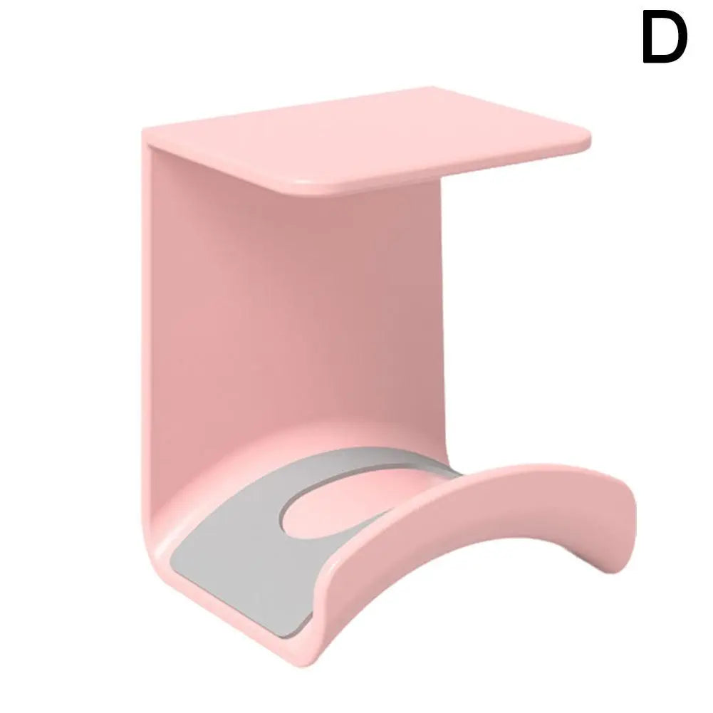 Pink adhesive wall mount headphone stand for desk, headset rack holder for gaming and earphones.