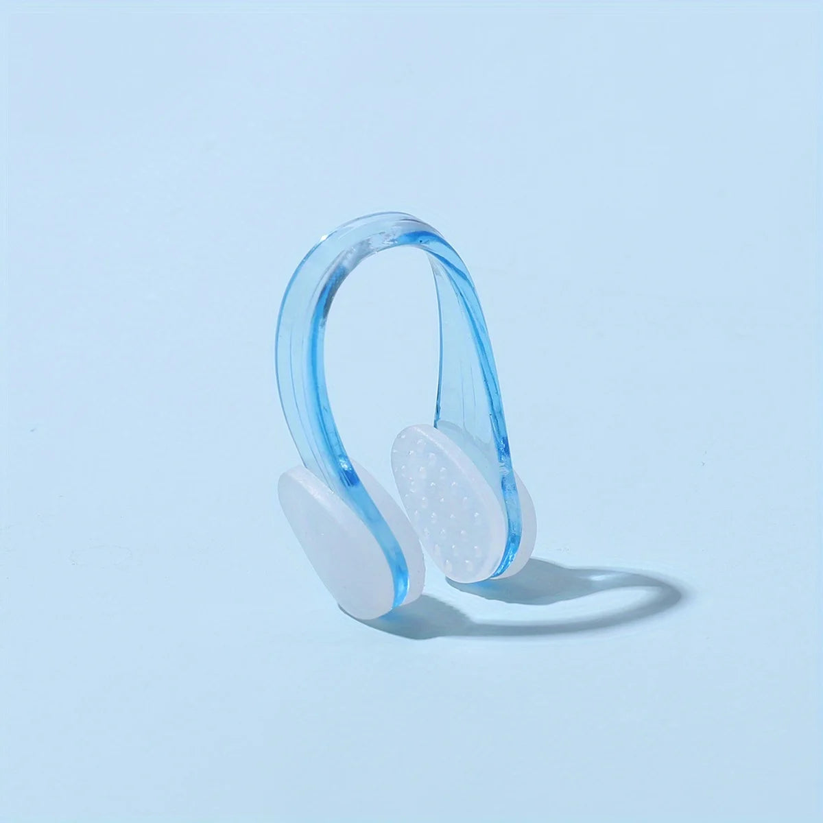 Professional swimming nose clip in blue, designed for comfort, anti-choking, waterproof, and non-slip use.