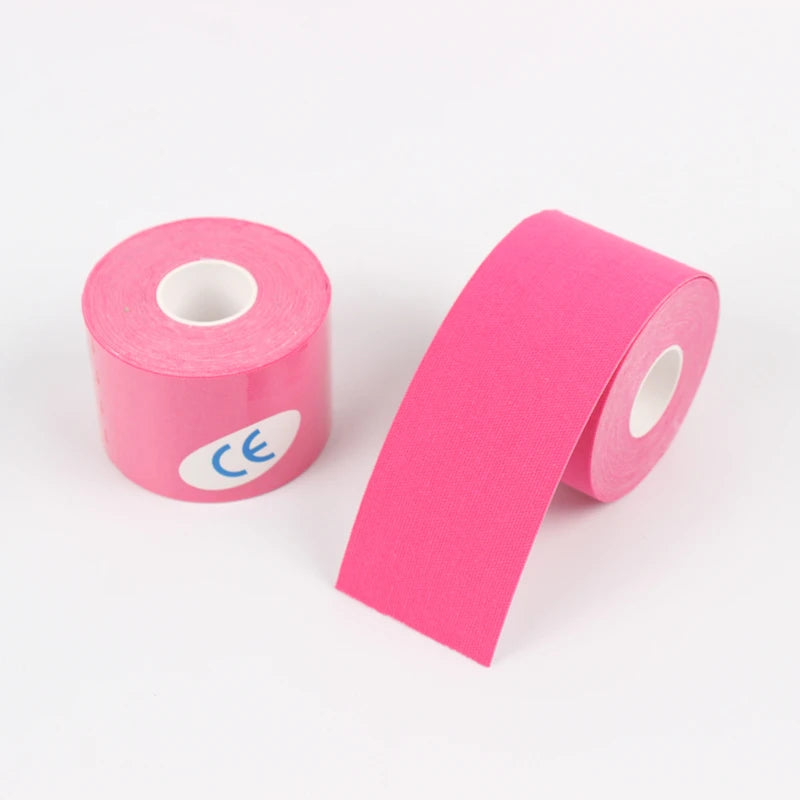 Pink kinesio tape roll for muscle support, athletic recovery, and knee pain relief in fitness.