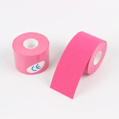 Pink kinesio tape roll for muscle support, athletic recovery, and knee pain relief in fitness.