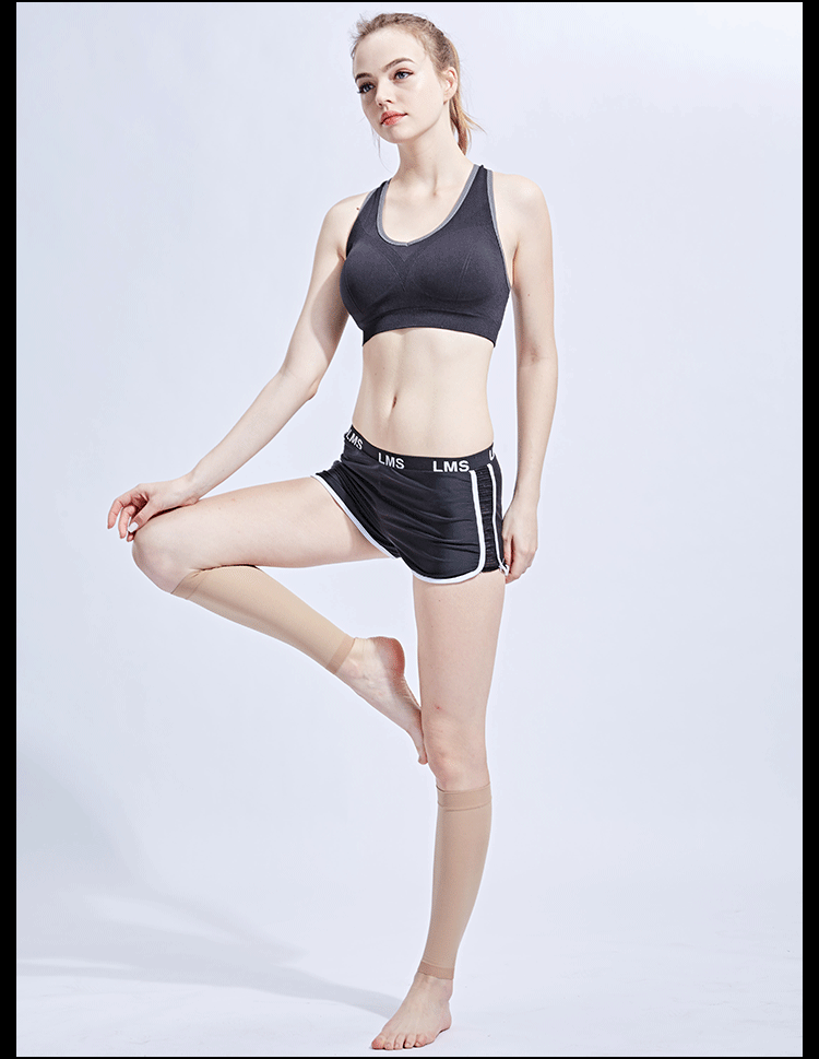 Young woman demonstrating compression calf socks while wearing sports attire, showcasing leg support and comfort.